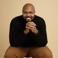 Dr Justin Lester